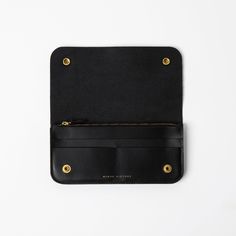 Flip open this leather snap wallet to reveal slots for credit cards or IDs, a zipper pocket for coins, and a generous compartment for bills and receipts. Features a simple, streamlined accordion shape that’s perfect for those who want to travel light, but not too light. 2 credit card or ID slots Zipper coin pouch 3 slip pockets for bills 1 small slip pocket Solid brass snaps closure Signature structured leather Dimensions: 8" W x 4" H x 0.75" D Looking for something smaller? Try the Little Ledger Wallet. Cash Organizer, Snap Wallet, Travel Light, Coin Pouch, Full Grain Leather, Credit Cards, 4 H, Mini Bag, Solid Brass