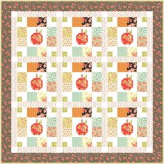 an apple quilt is shown on the wall