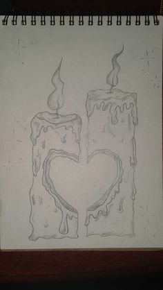 a drawing of two candles in the shape of a heart