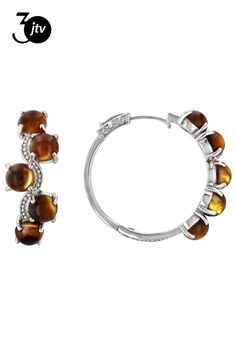 6mm Round Cabochon Tigers Eye Rhodium Over Sterling Silver Hoop Earrings. Measures Approximately 1.17"L x 0.47"W. Hinge with Noted post. Metal Clip-on Round Jewelry, Hinged Hoop Metal Jewelry, Round Metal Cabochon Earrings, Sterling Silver Round Clip-on Jewelry, Small Hoop Clip-on Earrings For Anniversary, Small Hoop Clip-on Jewelry For Anniversary, Round Clip-on Jewelry For Anniversary, Silver Hinged Hoop Jewelry, Hinged White Gold Round Jewelry