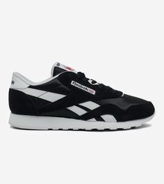 Elevate your casual style with these Reebok Royal Nylon Classic sneakers. Featuring a sleek black and white design, these sneakers are perfect for any occasion. The low-top shoe shaft style and medium width provide both comfort and style, while the nylon and suede material ensures durability. With a size of 10.5 and a UK shoe size of 9, these sneakers are perfect for both men and women. The Reebok Royal model is a timeless classic, and these sneakers are sure to be a staple in your shoe collection. Don't miss out on the chance to own these stylish and comfortable sneakers. Black Casual Nylon Sneakers, Casual Black Nylon Sneakers, Black Nylon Sneakers With Cushioned Footbed, Adidas Nylon Sneakers For Streetwear, Casual Adidas Nylon Sneakers, Reebok Royal, Shoe Men, Sneakers For Men, Comfortable Sneakers