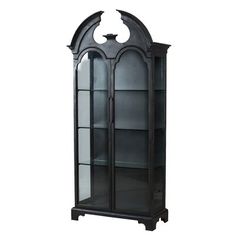 a black china cabinet with glass doors on the top and bottom shelves, in front of a white background