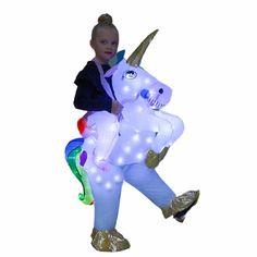 PRICES MAY VARY. Size: Kids Inflatable Costumes,for boy/girls age 3-6years old, it with a elastic waist, so easy to wear. Design: Kids unicorn costume with 70 LED Lights, can flash or solid light, Perfect for Day and Night Shows. and hat also comes with LED lights and hat include batteries. How to use: Put on the inflatable play wear suit, turn on the fan switch, let it inflate quickly, the fabric is very strong and light, easy to wear and walk. Use scene:this funny rider on unicorn costumer gre Kids Unicorn Costume, Blow Up Costumes, Inflatable Unicorn Costume, Kids Dinosaur Costume, Unicorn Costumes, Unicorn Costume Kids, Inflatable Unicorn, Halloween Blow Ups, Dinosaur Halloween