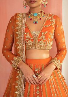 Orange Net Blouse Designs, Orange Colour Bridal Lehenga, Orange Chikankari Lehenga, Orange Lehnga Design, Orange Colour Dress Design, Dark Orange Lehenga, Orange Embroidered Choli For Reception, Orange Embroidered Sets For Reception, Embroidered Orange Choli For Reception