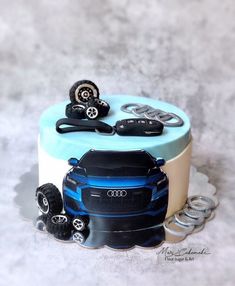 a cake with cars and wheels on it