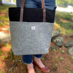 Made especially for us by Studio Tolsta is our TWT Harris Tweed Tote. Available in three colors, each tote is a perfect pairing of authentic Harris Tweed with cotton canvas and eco vegetable tanned leather. The results are stylish and classic in addition to being durable and sturdy. Perfect as your knitting project bag Fall Cotton Travel Bag, Fall Travel Cotton Bag, Canvas Bag For Everyday Fall Use, Canvas Bags For Everyday Use In Fall, Fall Everyday Canvas Bags, Black Tweed Bags For Everyday Use, Black Tweed Bags, Everyday Black Tweed Bag, Fall Canvas Bag With Leather Trim