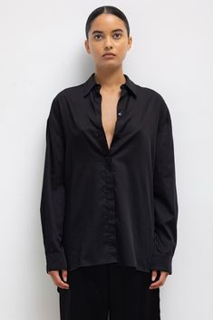 Crafted in our crisp and light Yoko Cotton, the Yoko Oversized Button Down II is an oversized silhouette with drop shoulders, a covered button placket, and a slightly elongated length. Shop all styles in this fabric group Oversized Shirt With Concealed Placket, Oversized Button-up Blouse With Concealed Placket, Black Oversized Top With Spread Collar, Black Oversized Tops With Spread Collar, Oversized Blouse With Button Closure For Daywear, Oversized Button Closure Blouse For Work, Oversized Blouse With Button Closure For Work, Oversized Button-up Blouse With Placket, Oversized Button-up Top With Concealed Placket