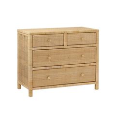 a wicker dresser with three drawers and two pulls on the bottom, against a white background