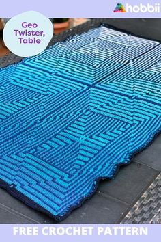 a blue crocheted rug with the words geo twister table on it