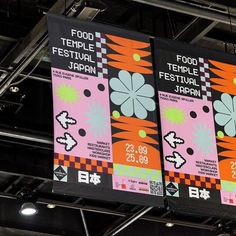 two banners hanging from the ceiling in a building