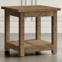 a small wooden table sitting on top of a hard wood floor