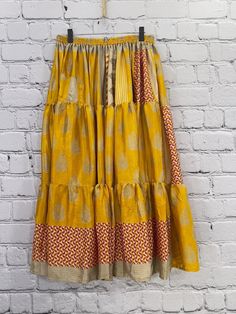 Twirl the day away in this gorgeous, buttery soft skirt. The long, full design is flattering to every shape. Made of vintage rasgulla silk saris. Each piece will be unique. Available in 2 sizes S/M 4-10 L/XL 12-18 Approximately 38” long Care Instructions: Hand wash and line dry for longest life. Disclaimer: The material used in this style is repurposed, vintage material. Small imperfections may be present. Fabrics may have small threads or holes in the layers. Small stains may be found. Soft Skirt, Repurposed Vintage, Vintage Material, Vintage Saris, Handmade Charms, Care Instructions, The Day, Im Not Perfect, Hand Wash