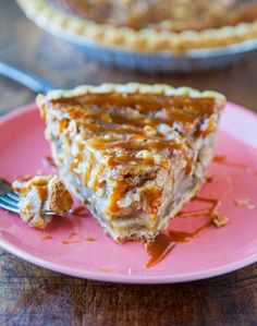 a piece of pie sitting on top of a pink plate