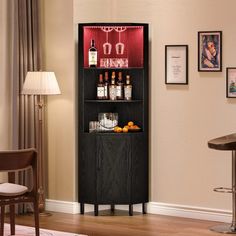 a bar with liquor bottles and glasses on it in the corner of a living room