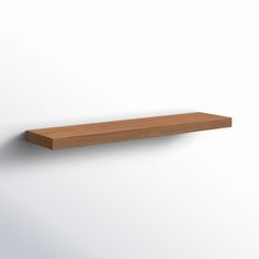 a wooden shelf on the wall with no one around it or in front of it