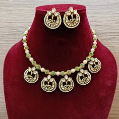 Description: Elevate your look with our Designer Gold Plated Kundan & Ruby Stone Necklace with Earrings. The intricate design and high-quality materials add a touch of elegance to any outfit. Perfect for special occasions or everyday wear, this set is a must-have for any fashion-forward individual. About: Eye-catching and unique jewelry that will set you apart. Gift this piece to a loved one, and see their face light up with joy. Best for gifting or for personal use, wear it to any occasion and Elegant Meenakari Metal Jewelry Sets, Festival Jewelry Sets With Matching Round Earrings, Festive Round Jewelry Sets With Matching Earrings, Festive Kundan Necklace With Matching Earrings, Kundan Necklace With Matching Earrings For Festivals, Diwali Jewelry Sets With Matching Earrings, Festive Round Kundan Necklace In Metal, Festive Round Kundan Metal Necklace, Festive Metal Kundan Necklace