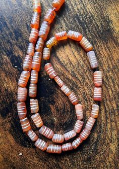 Ancient necklace from the Indus Valley About 1500 BC. Carnelian etching engraved. I can put a closure for free. Cylindrical carnelian with three etched stripes Length about 42cm, each stone is about 0.8 / 0.9mm The ancient technique of carnelian bead decoration dates back to the Indus Valley civilizations (Harappa and Moenjo Daro 3500- 1500 BC) was achieved by drawing decorative strokes on the surface with a mixture of potassium chloride and white lead, after which was passed in cooking. Engrave Ancient Necklace, Potassium Chloride, Indus Valley, Indus Valley Civilization, Carnelian Beads, Etching, Beauty Book, I Can, Beaded Necklace