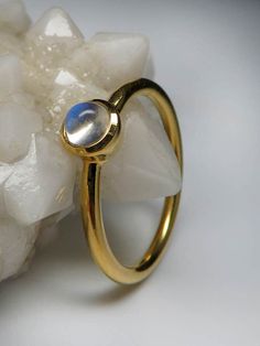 18K yellow gold ring with natural Adularia Moonstone round cabochon moonstone origin - Sri Lanka moonstone measurements - 0.12 х 0.16 х 0.16 in / 3 х 4 х 4 mm stone weight - 0.34 carats ring weight - 2.67 grams ring size - 7 US ref No 3018 Worldwide shipping from Berlin, Germany Feel free to contact us with any questions or for additional pictures or videos. We ship our jewelry worldwide - for our customers it is free of charge and fully insured (with tracking). To ensure that everything arrives Elegant Gold Moon-shaped Moonstone Ring, Gold Opal Ring Fine Jewelry, Yellow Gold Moonstone Ring With Polished Oval Cabochon, Yellow Gold Moonstone Ring With Oval Cabochon, Gold Celestial Moonstone Ring In 14k, 14k Gold Fine Jewelry Moonstone Cabochon Ring, Fine Jewelry 14k Gold Cabochon Moonstone Ring, Gold Round Opal Ring As Gift, Gold Opal Ring For Gift