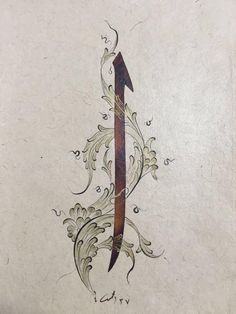 an arrow tattoo on the side of a white paper sheet with swirls and leaves