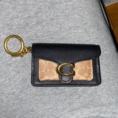 A Little Wallet To Hold Money Or Credit Cards That Can Be Attached To A Keychain Or Held In A Purse! Gold-tone Hardware Pouch Wallet, Elegant Wallets With Key Clip For Everyday Use, Elegant Wallet With Key Clip, Elegant Wallets With Key Clip, Elegant Bags With Card Slots, Compact Coach Bag For Everyday Use, Brown Coach Wallet With Interior Key Chain Holder, Chic Brown Card Holder For Everyday Use, Coach Gold Wallet For Everyday Use