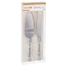 two forks and spoons in packaging on a white background