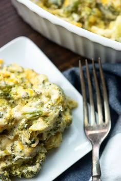 a white plate topped with broccoli casserole next to a pan of food