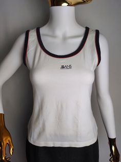 DOLCE & GABBANA vintage women's sleeveless top, made in Italy Good used condition, minor sign of wear Size tagged L, fits like M (please check measurements) Composition: 95% cotton, 5% elastane Measurements: Pit to pit - 15.7" / 40 cm Back length - 20.1" / 51 cm * All measurements are taken with the garment laying flat #5117 Fitted 90s Crew Neck Tank Top, 90s Style Stretch Cotton Tank Top, White Y2k Vest Top, Retro Cotton Tank Top, 90s Style Tank Tops For Summer, Y2k Style Crew Neck Cotton Tank Top, Y2k Style Cotton Crew Neck Tank Top, Y2k Crew Neck Cotton Tank Top, Y2k Cotton Crew Neck Tank Top