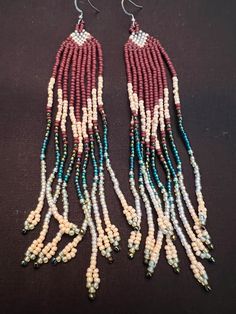 Hand made western style beaded earrings. Southwestern Beaded Fringe Dangle Earrings, Southwestern Style Beaded Fringe Dangle Earrings, Southwestern Style Beaded Dangle Earrings, Southwestern Beaded Dangle Earrings, Traditional Brown Beaded Earrings With Tiny Beads, Southwestern Handmade Dangle Beaded Earrings, Handmade Southwestern Dangle Beaded Earrings, Handmade Southwestern Beaded Dangle Earrings, Southwestern Style Earrings With Dangling Round Beads