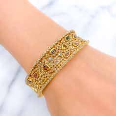 PRODUCT DETAILS Gold Purity(karat): 22k Item Weight(grams): 46.7 Item Finish: Yellow Gold Stone: Polki Diamond Diamond Weight(carats): 10.55ct Accented Stone: Tourmaline Stone Weight: 6.44ct Bangle Size: 2.4 Bangle Opening: 2.25" Openable: Yes, Hinge w/ Screw Gold Diamond Multi-stone Bracelets, Gold Diamond Bracelets With Multi-stones, Elegant Gold Bangle With Multi-stone Details, Elegant Gold Bangle With Multi-stone, Gold Bangle With Gemstone Accents, Yellow Gold Multi-stone Bangle For Wedding, Yellow Gold Multi-stone Wedding Bangle, Gold Cubic Zirconia Bracelet With Gemstone, Gold Cubic Zirconia Bracelet With Gemstone Accents