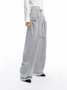 MO&Co. Women's Drawstring Wide Leg Pants Get ready to experience ultimate comfort with our pants! Made from pure cotton, these pants are soft and cozy to wear. With a drawstring waistband and side pockets, you can move freely and carry your essentials easily. Embrace a relaxed yet stylish look with our wide-leg design. Features : - High waist, wide leg- Elastic waistband with drawstring- Side slanting pockets, raw hem Code: MBD1PATT09The back length of size M is 110cmMATERIALS & CARE Material: 1