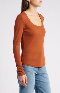 Build up your wardrobe with every color of this long-sleeve T-shirt made from a stretchy cotton and modal rib and fashioned with an appealing scoop neck. 23 1/2" length (size Medium) Scoop neck Long sleeves 55% cotton, 40% modal, 5% spandex Machine wash, dry flat Imported Scoop Neck Long Sleeve, Every Color, Sleeve Cotton, Scoop Neck, Long Sleeve Tshirt, Rust, Nordstrom, Size Medium, Spandex