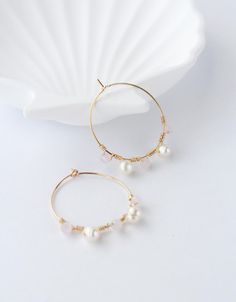 MONIQUE Earrings: Beautiful and elegant freshwater pearl and rose quartz hoop earrings, with gold-plated stainless steel hoops, handmade in the US. Perfect for any occasion. These simple yet stunning earrings are the perfect gift for a mom, sister, daughter, niece, aunt, granddaughter, bridesmaid or friend! FEATURES: *6mm natural freshwater pearls and 4mm rose quartz beads *Gold-plated stainless steel and stainless steel 30mm hoop CARE INSTRUCTIONS: *Remove before exercising taking a shower/bath Elegant Hoop Earrings For Wedding And Mother's Day, Elegant Hoop Jewelry For Mother's Day, Pearl Hoop Earrings With Ear Wire As Gift, Pearl Wire Wrapped Hoop Earrings As Gift, Pearl Hoop Earrings Wire Wrapped For Gift, Pearl Wire-wrapped Hoop Earrings As Gift, Pearl And Rose Quartz, Quartz Hoop Earrings, Cute Gifts For Her