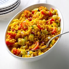 a white bowl filled with rice and vegetables