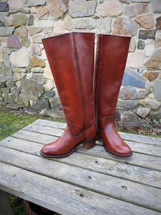 "Vtg 1970's Frye Dark Brown Western Boots, Heeled Ladies Boots, Leather Riding Boots sz 5 1/2 B This is a great pair of vintage ladies Frye Riding Boots. Known for their quality boots, these Frye Western Style Pull-On Boots are no exception. They are almost a deep reddish brown color with some distressing which I really like. These boots are well marked with the Frye mark at the heel of the boot as well as on the inside. Made of very thick and durable leather, these boots are certain to last for Vintage Vegetable-tanned Leather Boots, Vintage Goodyear Welted Boots With Almond Toe, Vintage Plain Toe Boots With Leather Lining, Vintage Fall Moto Boots With Leather Lining, Vintage Goodyear Welted Boots For Fall, Vintage Goodyear Welted Boots With Round Toe, Fitted Vintage Boots With Goodyear Welt, Fitted Vintage Boots With Goodyear Welted, Vintage Leather Boots With Wide Calf