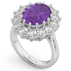 Style Number - AZ16271
This prestigous diamond accented amethyst ring is inspired by the engagement ring worn by Princess Diana and Princess Kate Middleton. This unique and luxurious ring makes a statement with its 12x10mm genuine and natural oval shaped purple amethyst that is complemented by 14 brilliant-cut round near-colorless diamonds of G-H Color, SI Clarity in an oval halo fashion. The purple colored gemstone and clear diamond stones rest on a remarkably stunning platinum band.This Lady D Luxury Purple Amethyst Ring With Halo Setting, Luxury Lavender Ring With Center Stone, Luxury White Gold Amethyst Ring With Halo Setting, Luxury Lavender Amethyst Ring With Center Stone, Luxury Lavender Amethyst Ring For Anniversary, Luxury Platinum Amethyst Ring With Center Stone, Luxury Brilliant Cut Amethyst Ring For Anniversary, Luxury Lavender Ring With Prong Setting, Luxury Amethyst Ring With Diamond Halo Setting