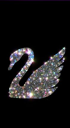 an image of a swan made out of sparkling lights