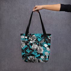 Make a statement with our stunning floral tote bag, perfect for carrying your essentials in style.  The vibrant floral print adds a pop of color to any outfit, while the sturdy canvas material ensures durability and longevity. With plenty of room to store your everyday items, this spacious tote features both interior and exterior pockets for easy organization.  The comfortable shoulder straps make it easy to carry, whether you're running errands or heading to the beach. Versatile and chic, this Travel Cotton Bag With Floral Print, Travel Bag With Floral Print In Cotton, Blue Floral Print Shoulder Bag For Everyday, Cotton Travel Bag With Floral Print, Trendy Cotton Bags With Floral Print, Trendy Blue Floral Print Bags, Everyday Blue Floral Print Shoulder Bag, Spring Floral Canvas Shopping Bag, Floral Print Canvas Tote Bag For Daily Use