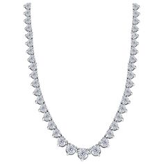 An exquisite classic round brilliant diamond straight-line necklace. This 114 round brilliant cut diamond necklace is perfect for every occasion. 17 inches long with a total diamond weight of 10 carats. Quality grading is white color H and clarity SI, you'll be sure to dazzle in the 3 claw graduating setting with a line of diamonds that are matched to near perfection skilfully crafted and hand set to maximise the brilliance and fire of each diamond, in 18 karat white gold and British hallmarked setting. This necklace is hallmarked. It is also available in other diamond carat sizes and lengths. 10 Carat Diamond 18 Karat White Gold, 3 Prong Setting Riviera Necklace, Diamond Carat Size, Chris Evert, Diamond Tennis Necklace, Heritage Jewellery, White Gold Necklaces, Tennis Necklace, Modern Necklaces, Link Necklace