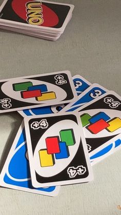 four matching card game pieces sitting on top of a table