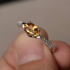 This is a gorgeous handmade creation. Its beauty is its simplicity & Elegance. The 5*7 mm oval shape faceted natural citrine is crafted in solid sterling silver and with rhodium plated. All item is sent in a beautiful gift box If you have any idea of design your ring,pls contact me directly. You can realize more lovely stuff clicking the link https://www.etsy.com/shop/knightjewelry?refshopsection_shophome_leftnav Please leave the correct address and you phone number for delivering successful Oval Citrine Birthstone Ring, Oval Yellow Citrine Birthstone Ring, Oval Citrine Birthstone Ring For Anniversary, Faceted Oval Topaz Ring In Sterling Silver, Oval Citrine Topaz Ring In White Gold, Oval Faceted Topaz Ring In Sterling Silver, Oval Citrine Crystal Ring With Birthstone, Oval Citrine Birthstone Crystal Ring, Amber Birthstone Ring