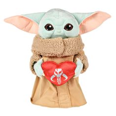 the child yoda doll is holding a heart