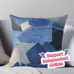 a patchwork denim pillow with the words support independent artists on it