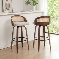 These counter stools blend style and functionality for an inviting seating option at your kitchen island or bar area. Arriving is a set of two, both stools feature a rattan back and a 360-degree swivel for easy movement. Built with solid bentwood legs and a footrest, this stool set ensures stability and durability, promising years of reliable use. The bucket seats are upholstered in foam-filled linen fabric for a cushioned spot to sit and enjoy your favorite drink or meal. George Oliver Seat Hei Beige Bar Stools, Island Bar Stools, Apartment Bar, Bar Counters, Tall Bar Stools, Space Efficiency, Rattan Bar Stools, Island Stools, Bar Stools Kitchen Island