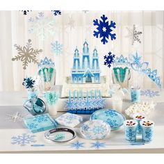 a table topped with blue and white decorations