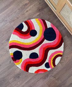 a colorful rug on the floor in a room