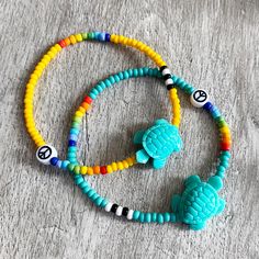 I love these turtle beads. Made a bracelet with them as soon as they arrived and couldn't wait to get them in my Etsy shop. Quality Czech glass beads in solid colours. Choose your main colour. The rainbow and the black and white will stay the same on whichever colour you chose. Shown in golden yellow and turquoise. Available immediately 4 different sizes but if you require a different size, just ask. Everything is made to order so I can make it suitable for you. Casual Turquoise Beads For Beach, Hippie Green Bracelets For Beach, Hippie Green Bracelet For Beach, Green Hippie Beach Bracelets, Playful Round Beads Friendship Bracelets For Beach, Hippie Colorful Beaded Bracelets For Beach, Casual Beach Bracelet Beads, Playful Adjustable Turquoise Beaded Bracelets, Turquoise Beaded Bracelets For Beach In Hippie Style