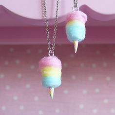 two necklaces that have been made to look like ice cream cones with rainbow colors