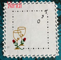 a cross stitch pattern with two wine glasses on it and the words vendai written in red