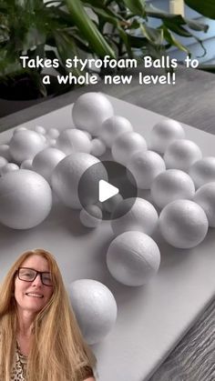 a woman standing in front of a table with balls on it and text that reads, takes styrofoam balls to a whole new level