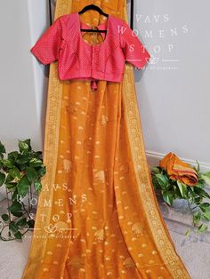 Blouse stitched - Yes Blouse Opening - Front Sleeves Length - Elbow Padded - No Blouse size - 40 with inner margins expandable upto 46 For Blouse Size 38 alteration can be done on request. Fall/pico - Yes done Fitted Silk Blouse For Traditional Ceremonies, Fitted Orange Saree For Transitional Season, Fitted Blouse With Zari Weaving For Traditional Ceremonies, Orange Blouse For Navratri, Fitted Orange Blouse Piece With Traditional Drape, Orange Blouse With Zari Weaving For Diwali, Fitted Blouse With Cutdana For Traditional Ceremonies, Orange Blouse With Zari Weaving For Festivals, Fitted Orange Blouse For Navratri